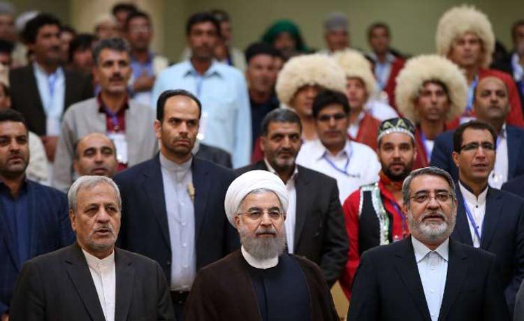 تصویر شهید مدافع حرم گرگانی در همایش روز ملی عشایر و روستا با حضور رئیس جمهور
